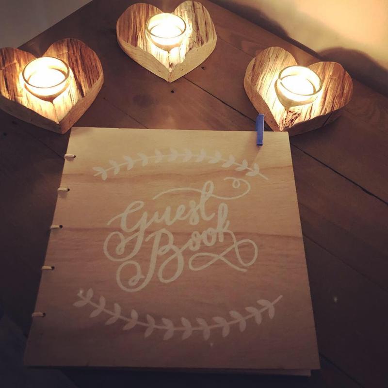 Secret of Eden guest book by candlelight